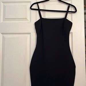 Lulu’s small black slip dress